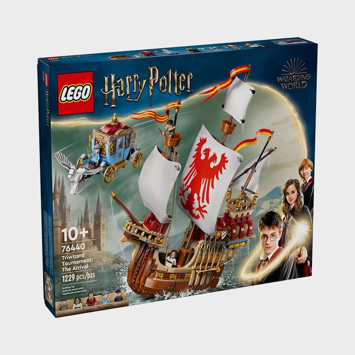 Lego set box displays flying carriage and ship with sails on water, featuring Harry Potter characters. Text: â€œ76440 Triwizard Tournament: The Arrival, 1229 pcs.â€