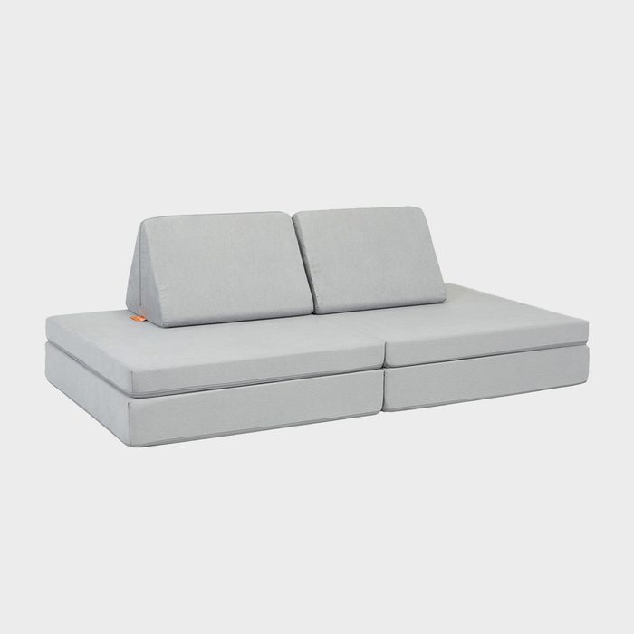 Grey modular sofa arranged in a seating position with triangular backrests, set against a plain white background.