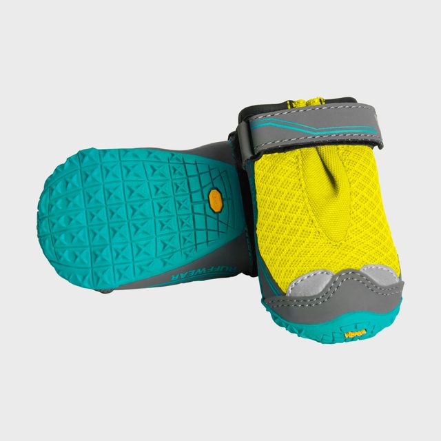 Yellow and gray dog booties with blue soles, one resting sideways and the other upright, displayed on a plain background.