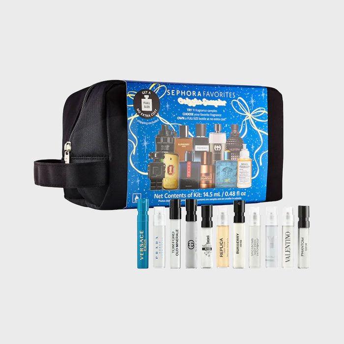 A toiletry bag displays multiple fragrance samples in front, set against a blue background with perfume images and promotional text.