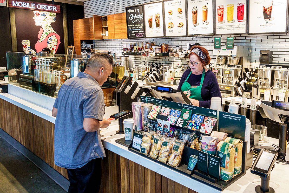 Charlotte, North Carolina, Starbucks Coffee, barista taking order, credit card scanner.