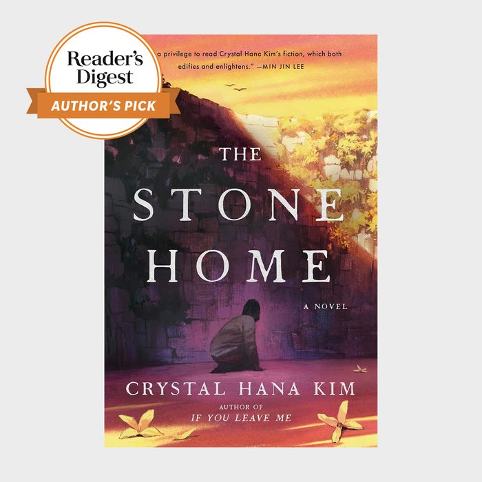Book cover displays a person sitting beside a stone wall, surrounded by yellow leaves. The sky is vibrant at sunset. 
