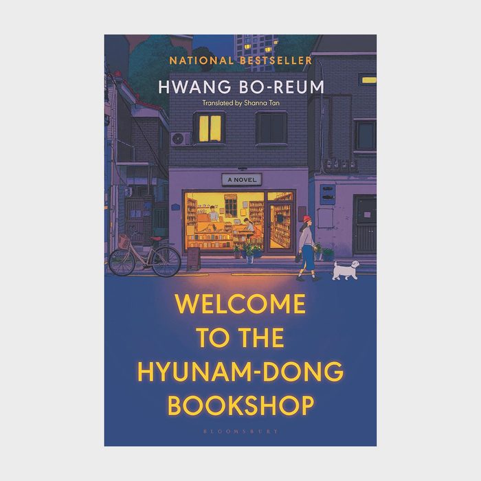 Book cover shows a cozy bookshop at night, with a person and dog walking outside. Text: 