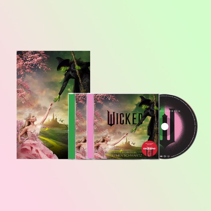 Two characters reach toward each other; one in pink, one green. Surrounding them, a soundtrack CD cover features text 