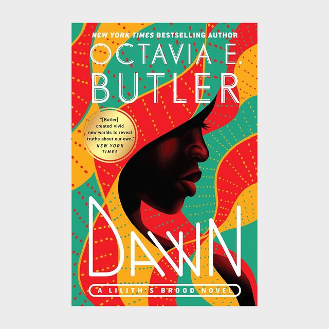 Silhouette of a woman's profile is set against a vibrant, abstract background with text: 