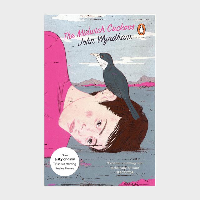 A black cuckoo perches on a man's sideways head against a stylized landscape. Text: 