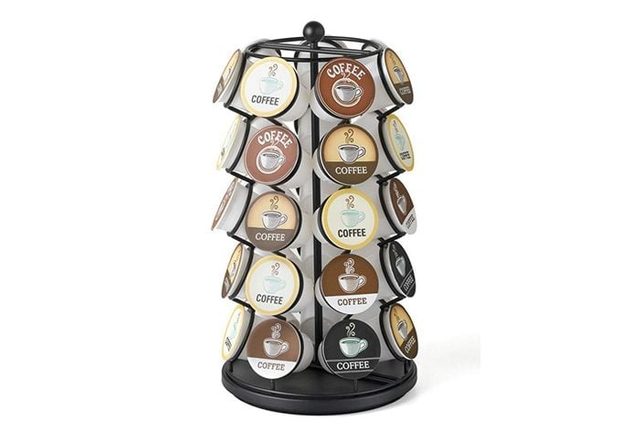 A rotating stand holds various coffee pods labeled 