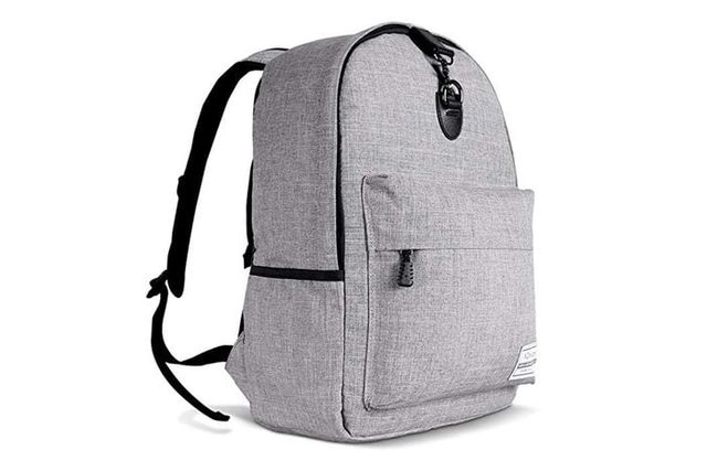 A gray backpack sits upright, featuring a front pocket and a buckle, with black straps, set against a plain white background.