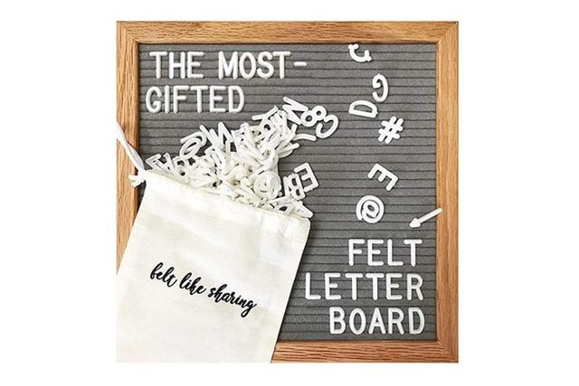 Felt letterboard displays scattered letters. Text reads 