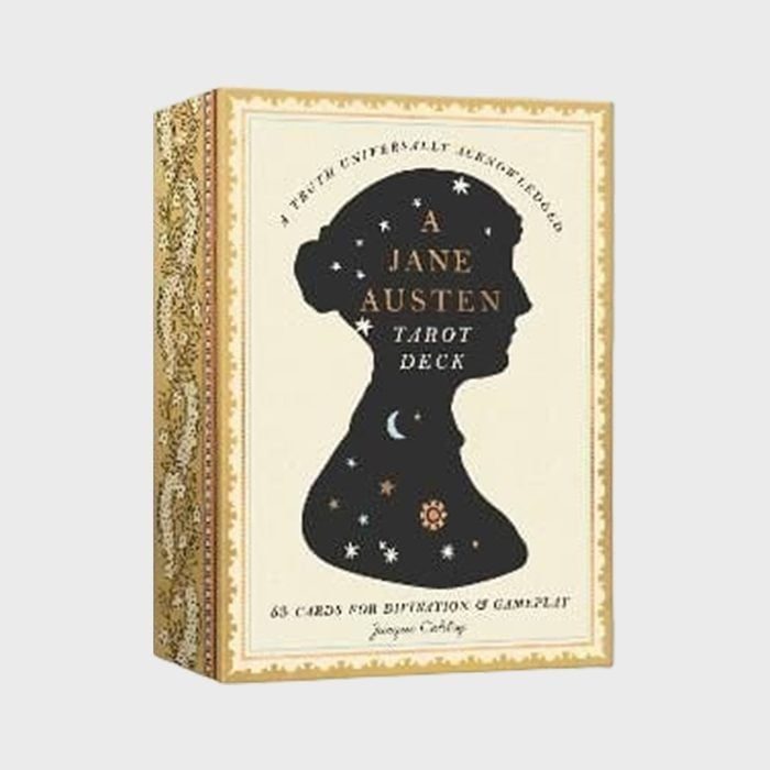 Tarot deck box displays silhouetted figure with celestial symbols against ornate background, labeled 