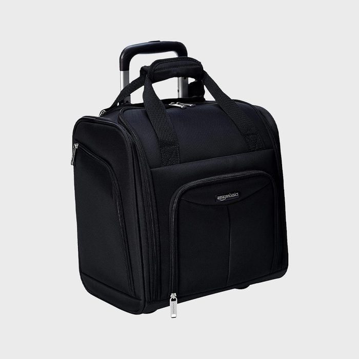 Black wheeled luggage stands upright with extended handle; features multiple zippered compartments. Text reads: 