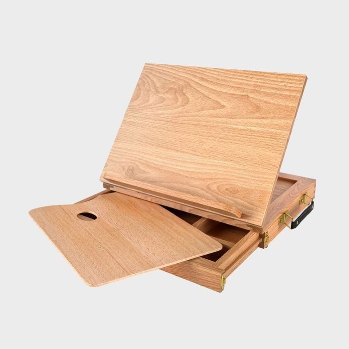Wooden art box with removable palette opens to reveal storage compartments, set against a plain background.