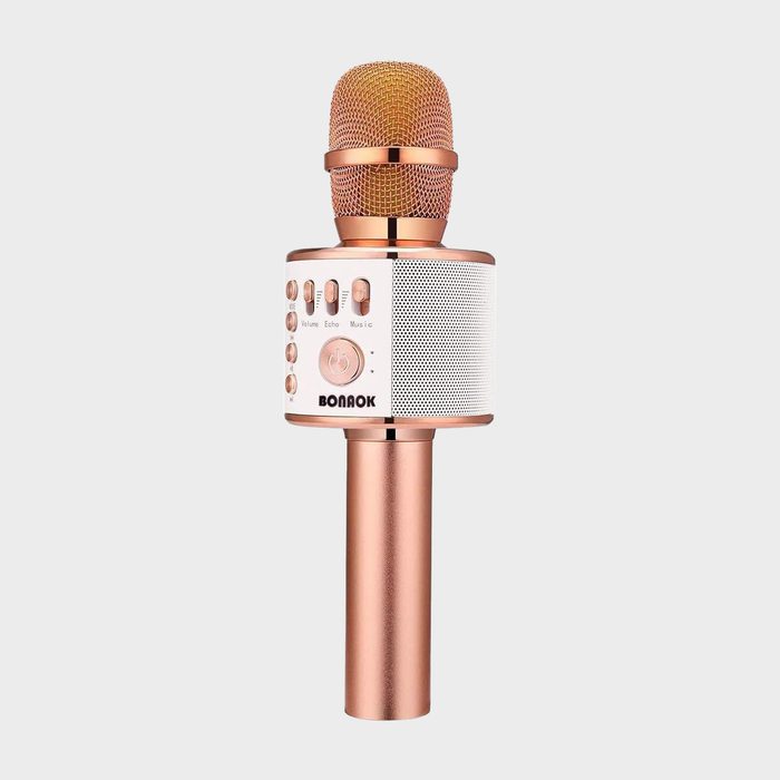 Microphone features control buttons and a speaker, designed in metallic rose gold, against a plain white background.