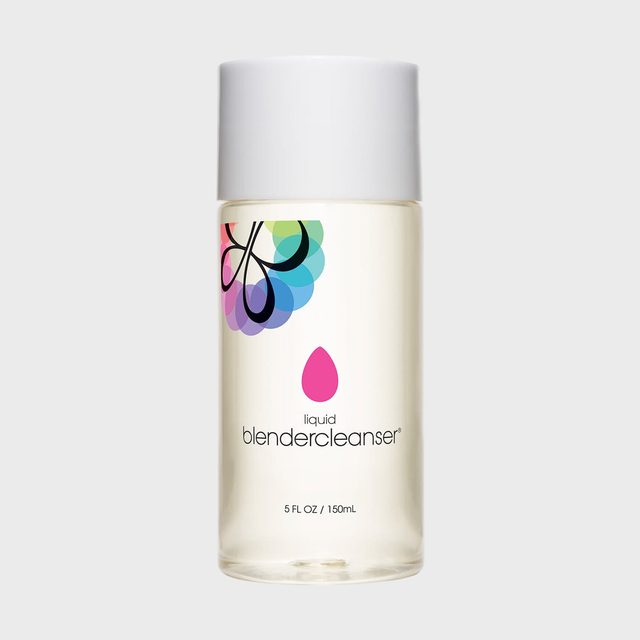 A clear bottle with a white cap displays colorful branding and text: 