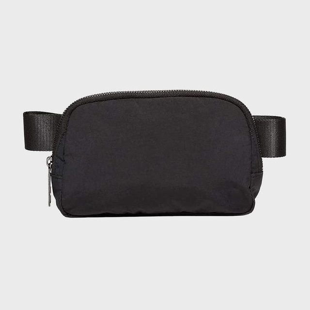 A black waist bag sits against a plain gray background, featuring a zipper at the top and adjustable straps on each side.
