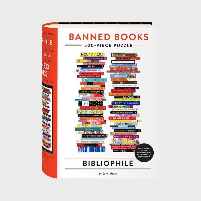 Puzzle box displays stacked colorful book spines, labeled 