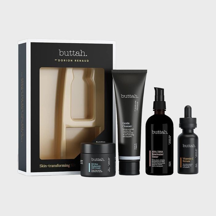 Skincare set includes cleanser, toner, serum, cream in sleek black packaging, beside an illustrated box labeled 