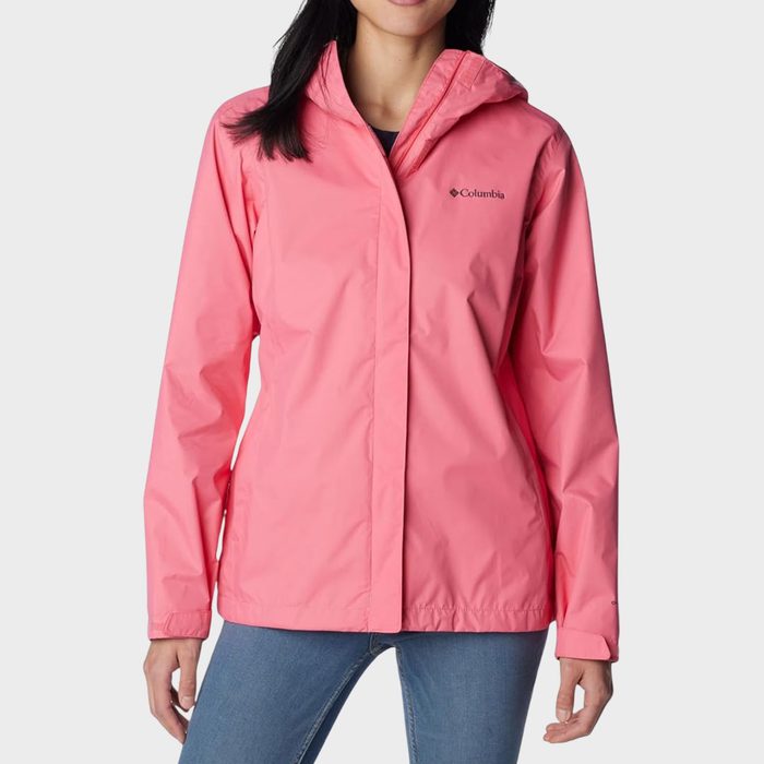 Pink jacket being worn stands against plain background; 