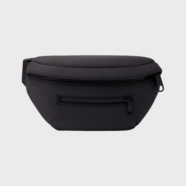 A black fanny pack with two zippers lies against a plain gray background.