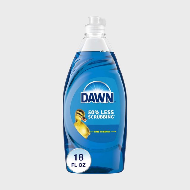 A blue dish soap bottle stands with a label reading 