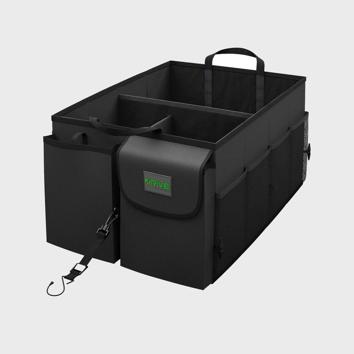 Black car trunk organizer with multiple compartments and handles, featuring adjustable straps and exterior pockets, set against a plain gray background.