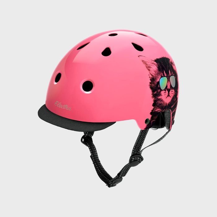 Pink helmet featuring a cool cat with sunglasses, resting against a plain gray background.
