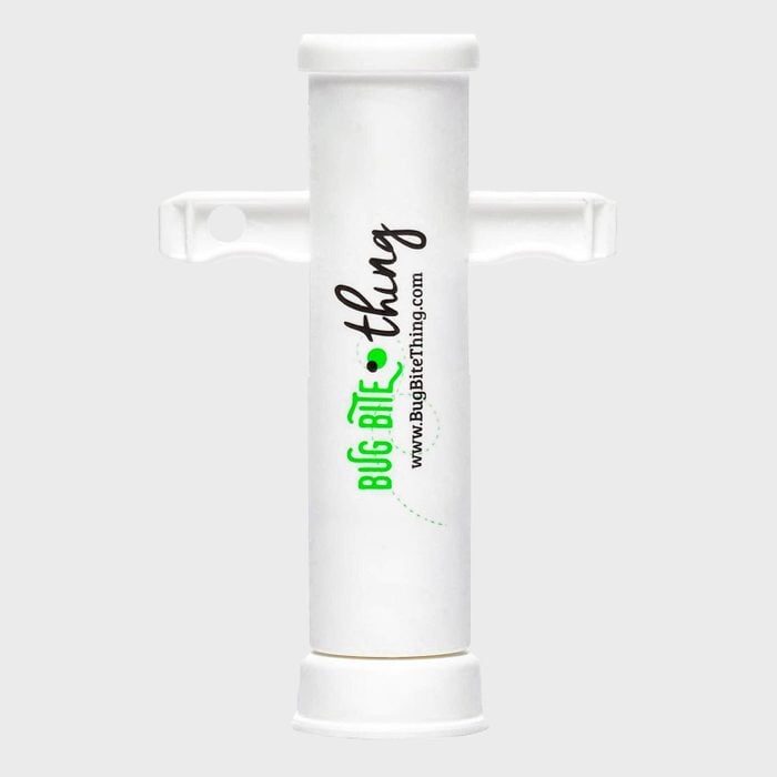 A white suction tool stands upright with printed text 