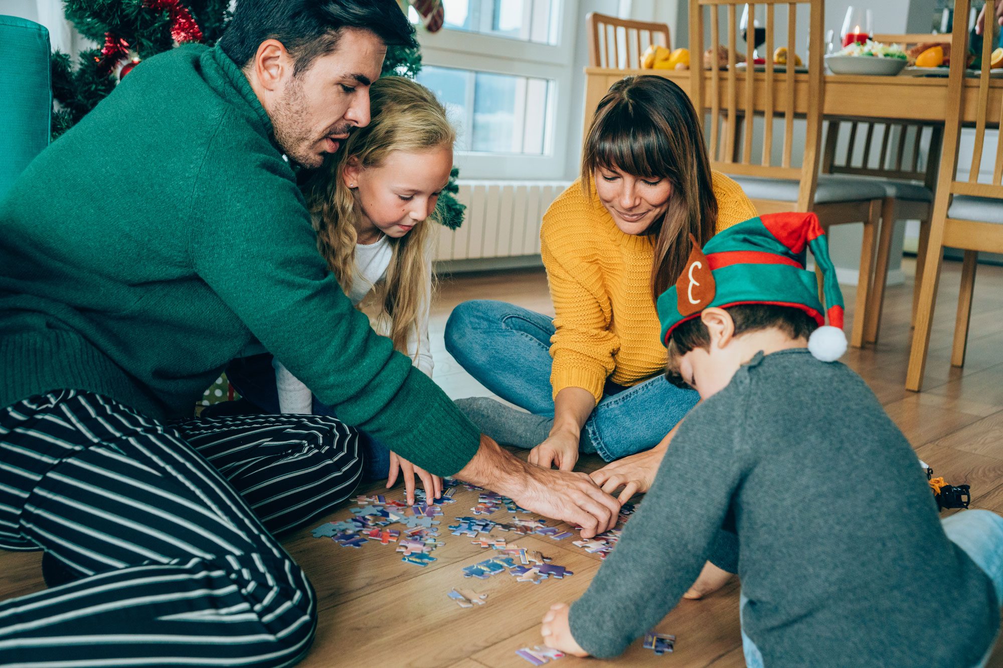 Family Playing With The New Christmas Gifts