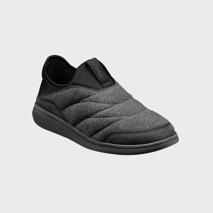 Gray slip-on shoe with quilted texture, black sole, and subtle branding, displayed on a plain light gray background.