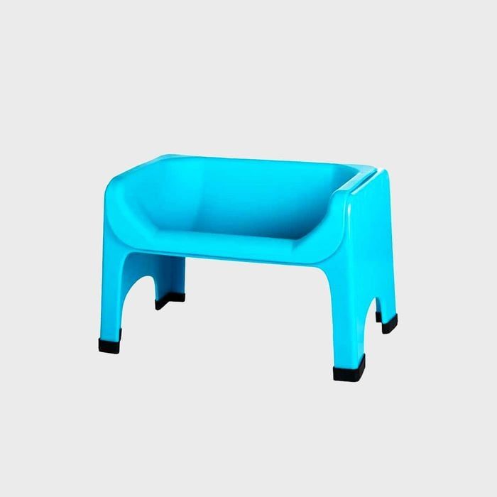 Bright blue elevated pet bowl stand sits on a plain gray background.