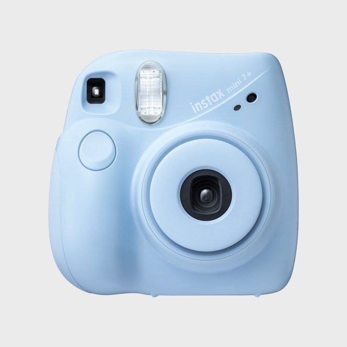 A light blue instant camera sits idle against a plain background.