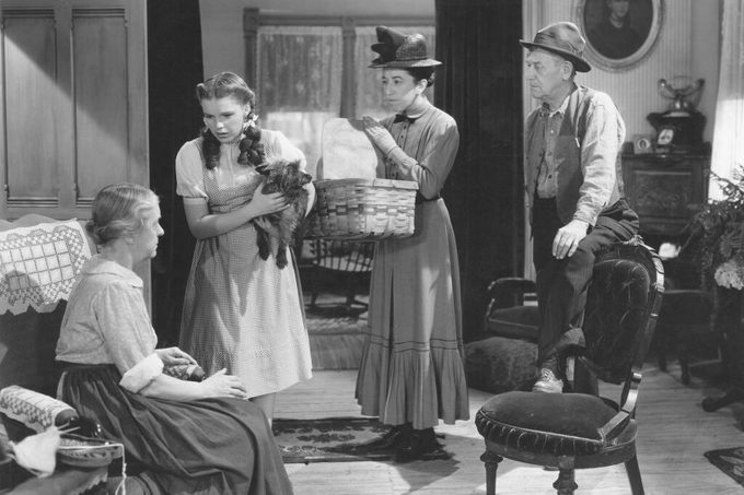 From left to right, Clara Blandick, Judy Garland, Margaret Hamilton and Charley Grapewin star in the MGM film 'The Wizard of Oz', 1939. In this scene, Almira Gulch arrives to take Dorothy's dog Toto away for termination, after he bit her.