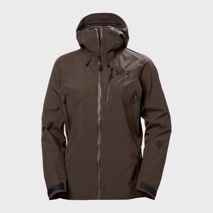 Brown hooded jacket displayed upright, featuring zippered pockets and brand logo, on a plain gray background.