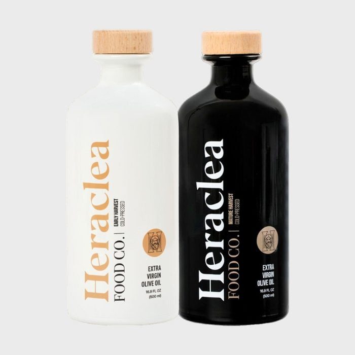 Two bottles stand upright; one white, one black. Both labeled 