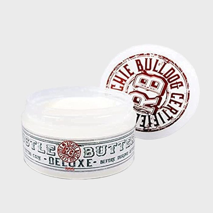 Jar holds white cream, labeled 