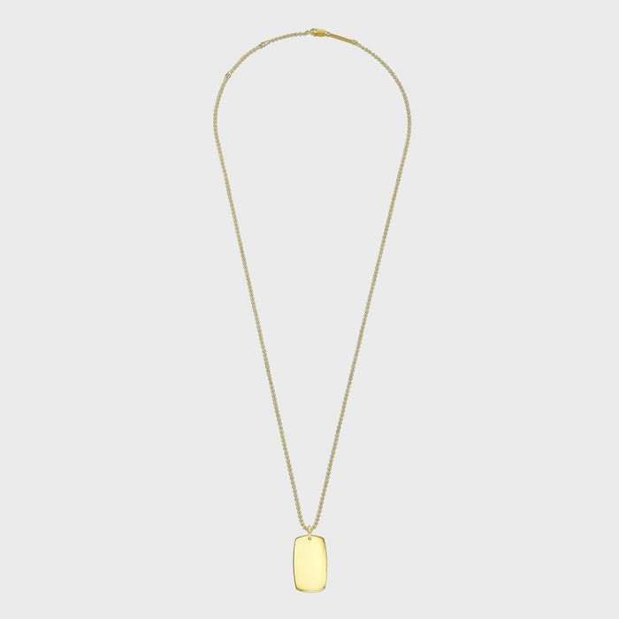 A gold rectangular pendant hangs from a delicate chain, set against a plain white background.
