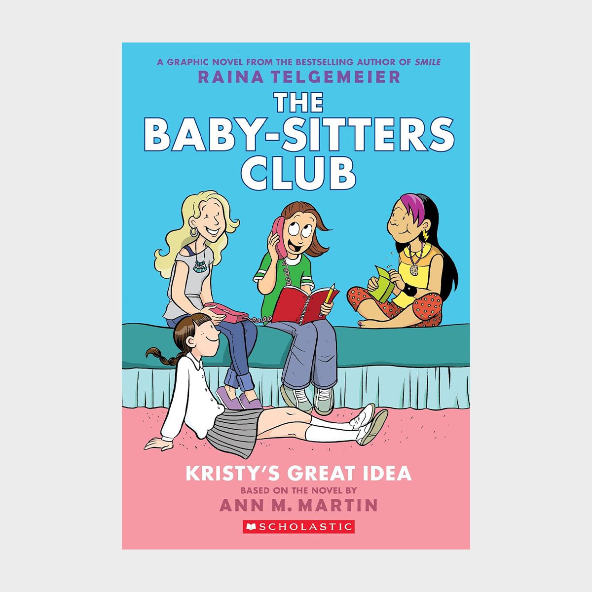 Four girls sit and chat on a bed, surrounded by books. The setting is cheerful and colorful, with "The Baby-Sitters Club" text above.