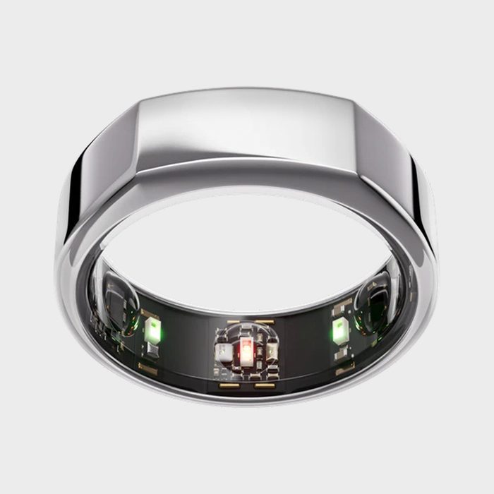 Silver smart ring showing internal electronic components with LEDs, displayed against a plain white background.