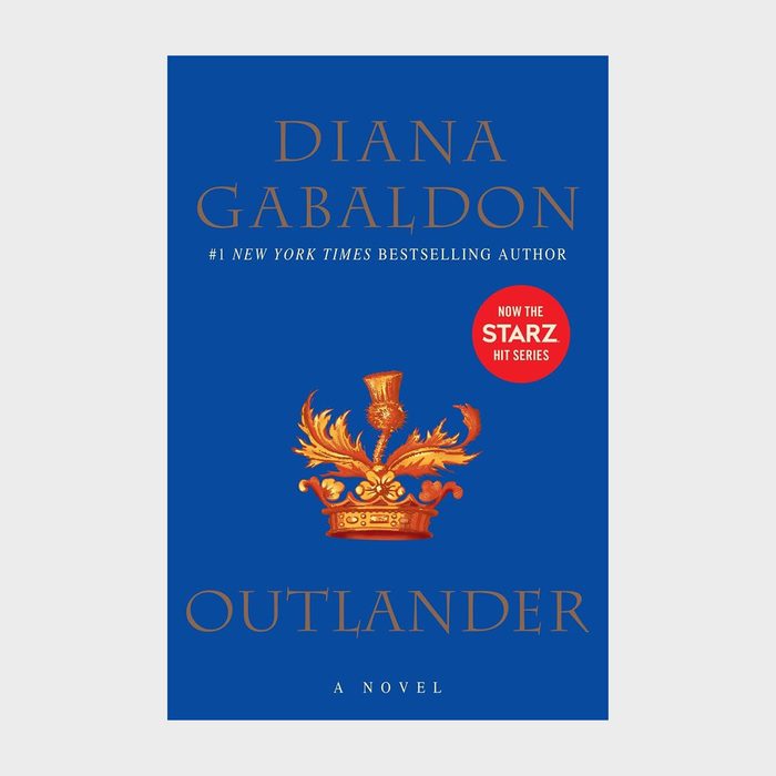 Book cover displays a gold symbol on a blue background, featuring 