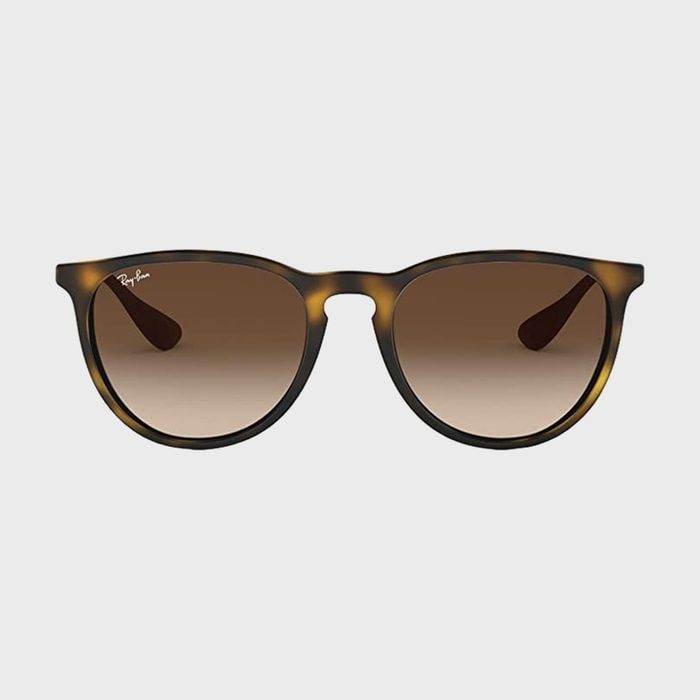Sunglasses with brown gradient lenses are displayed against a white background. 