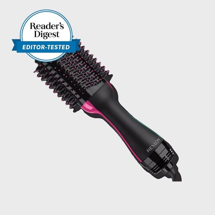 A hair dryer brush shown at an angle with text 