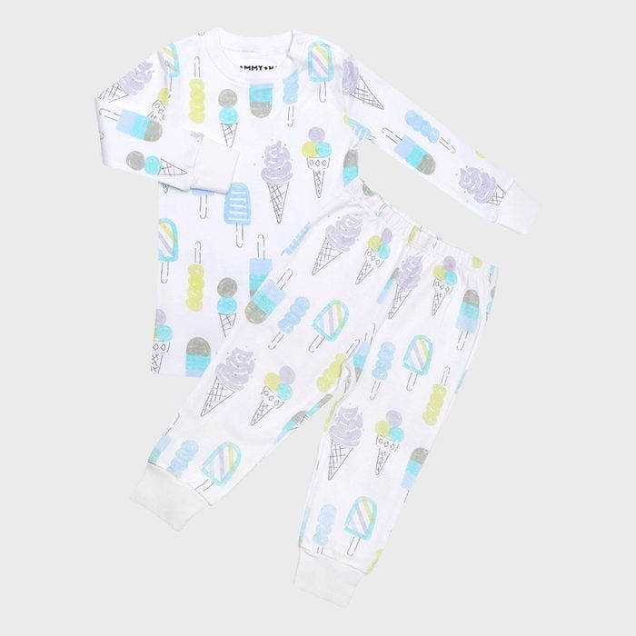 Pajama set features playful pastel ice cream patterns on a white background, displayed flat with long sleeves and pants.