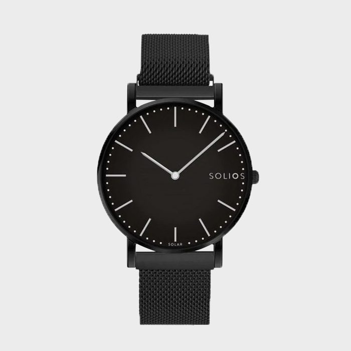 Black watch shows time with minimalist lines; text reads 