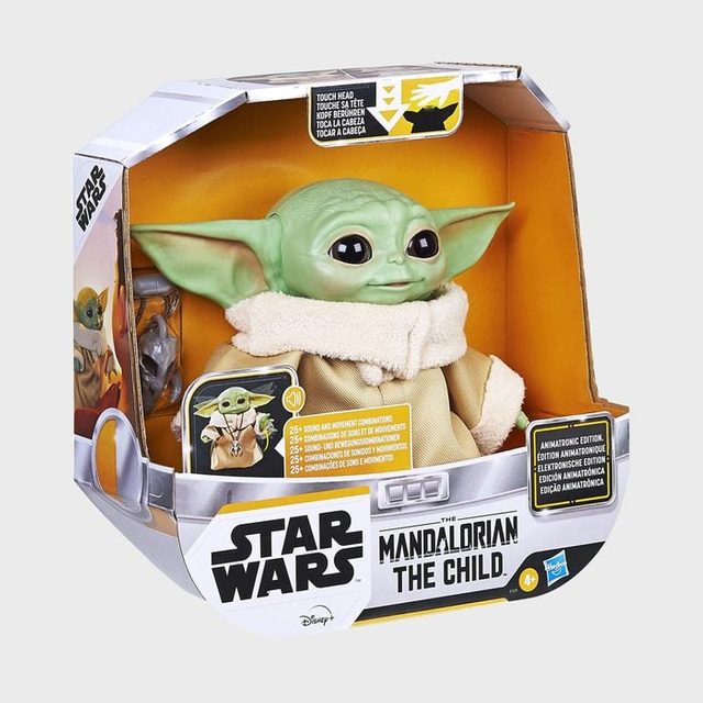 Toy figure sits in packaging, titled 