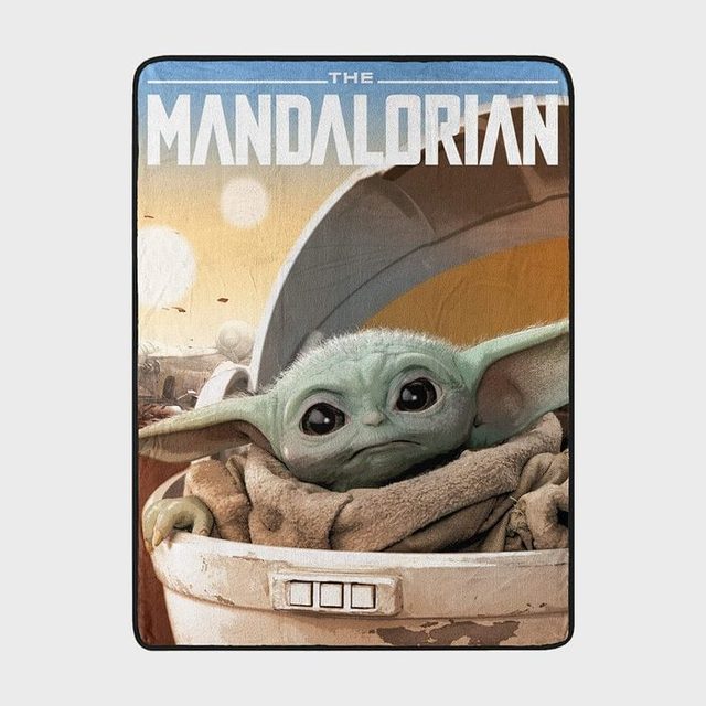 A small green creature sits in a pod; desert landscape behind. Text reads 