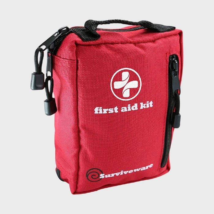 Red first aid kit sits upright with zippers, displaying 