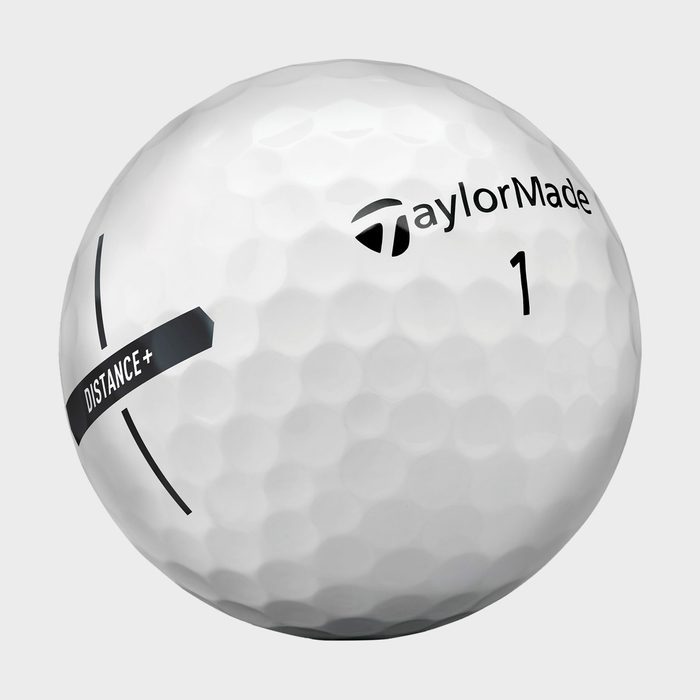 A white golf ball displays brand name 