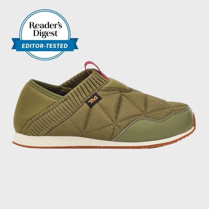 Olive green slip-on shoe with quilted design and logo tag, displayed on a plain background. Reader's Digest Editor-Tested badge in upper left.