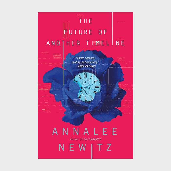 Book cover shows a blue flower overlaying a clock, set against a red background. Text: 