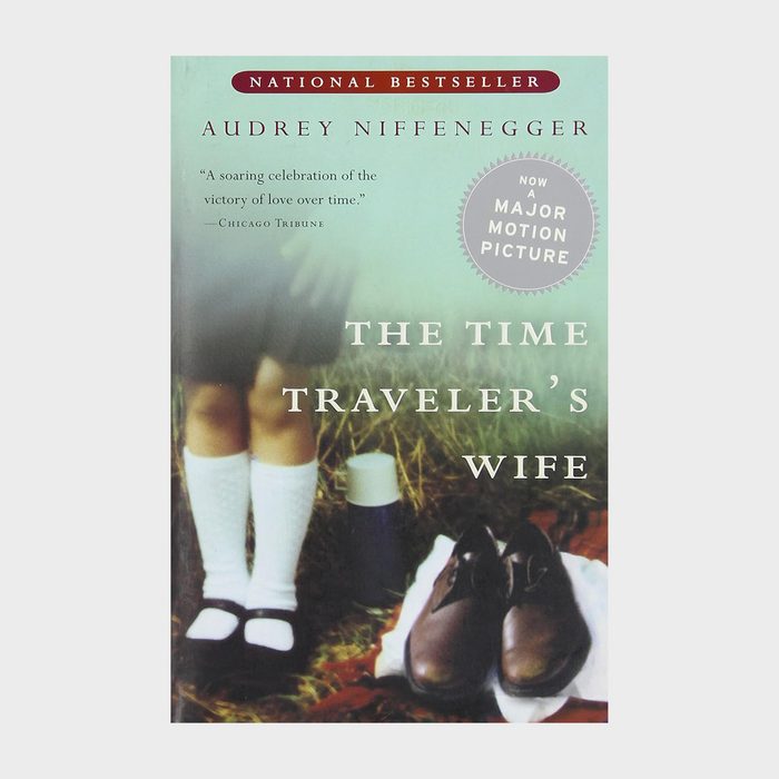 Book cover shows a girl's legs standing by shoes and picnic items on grass. Text reads 